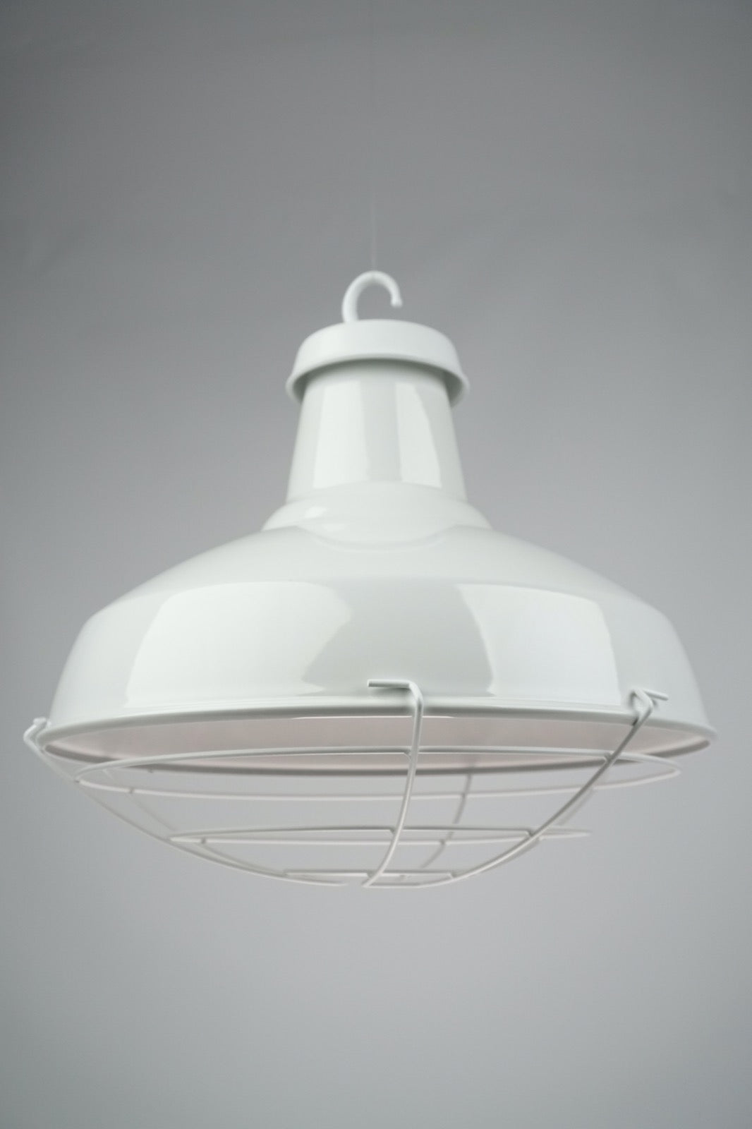 A white enamel 36cm Reflector lamp shade. Gloss white shade, with white gallery and hook and white cage below the shade.