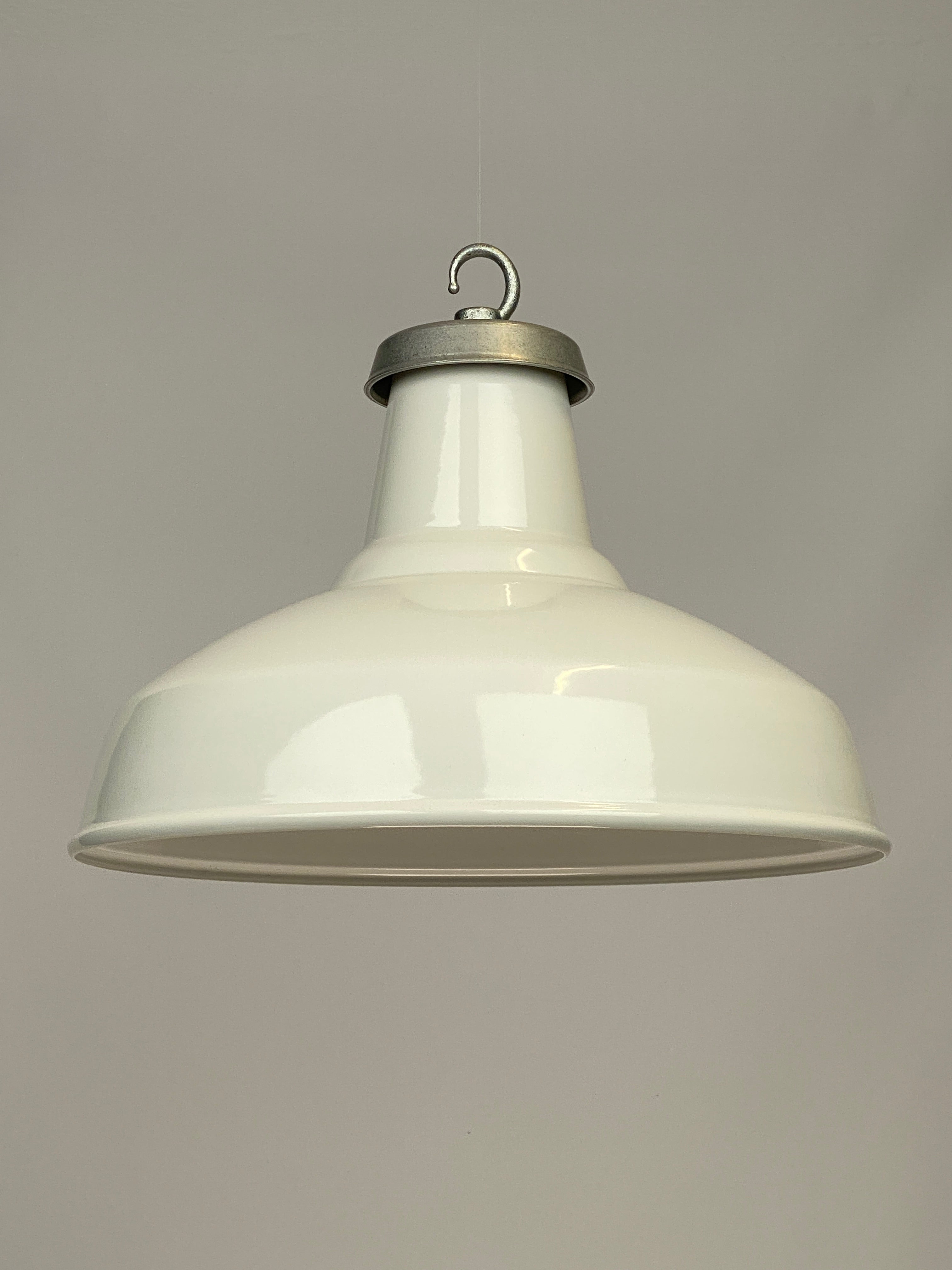 Example of a worn lighting shade. This is a white gloss enamel shade with stone rumbled aluminium gallery & galvanised hook.